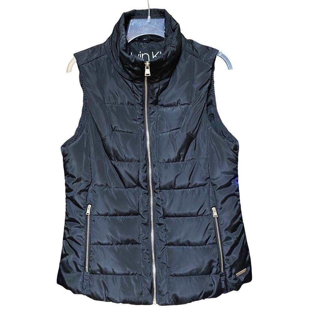 Calvin Klein black w/gold zippers vest. Women’s size M